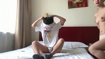 A Pair Of Chinese Lovers Engage In Intimacy Within A Hotel Suite